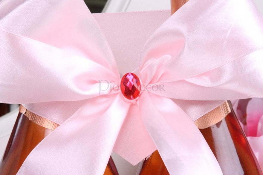 Нежно розовый бант на шампанское от  3