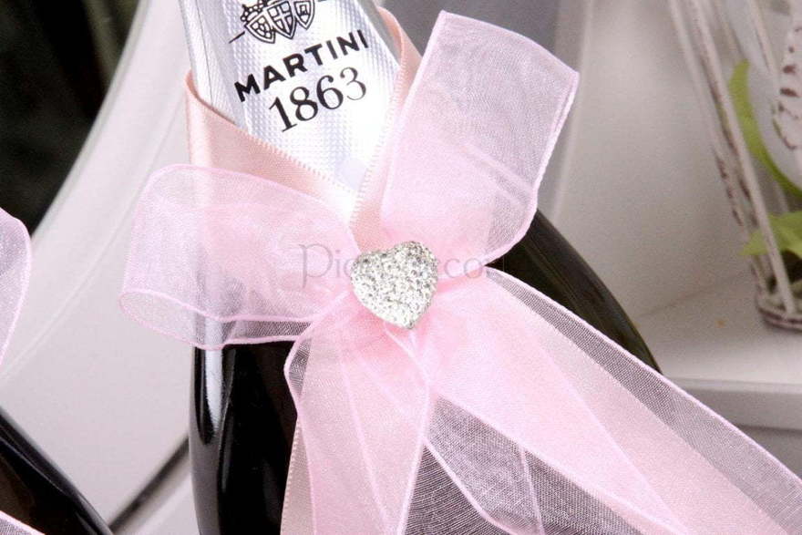 Розовые ленты на шампаснкое от  3