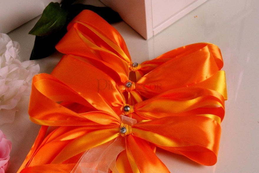 Оранжевые банты на ручки авто от  2