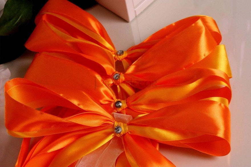 Оранжевые банты на ручки авто от  3