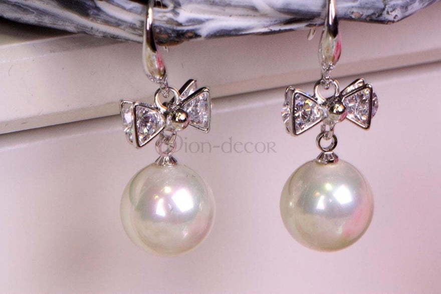 Серьги с цирконами Бантики серебристые из Посеребренная бижутерия от  2